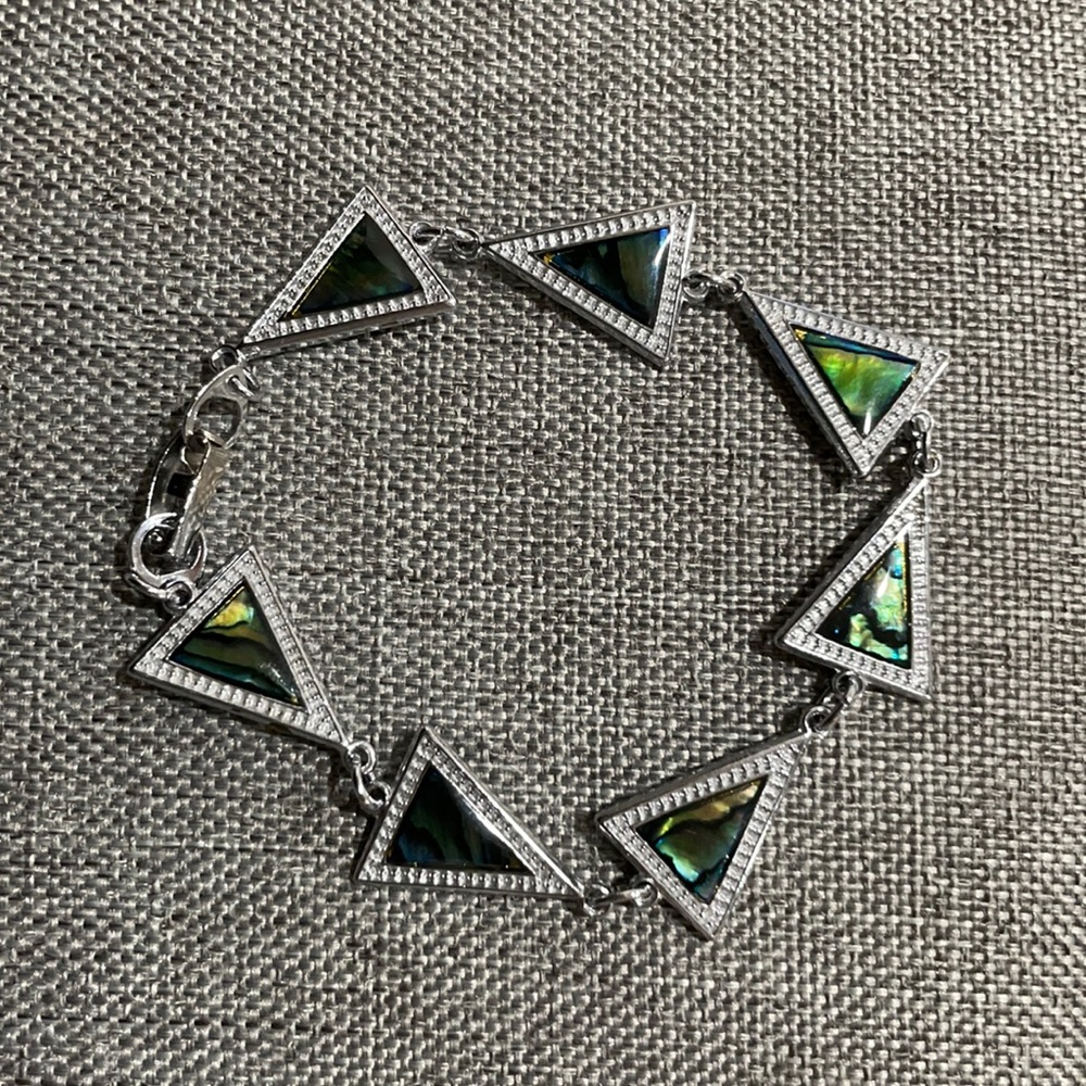 Silver triangle bracelet with faux green stones